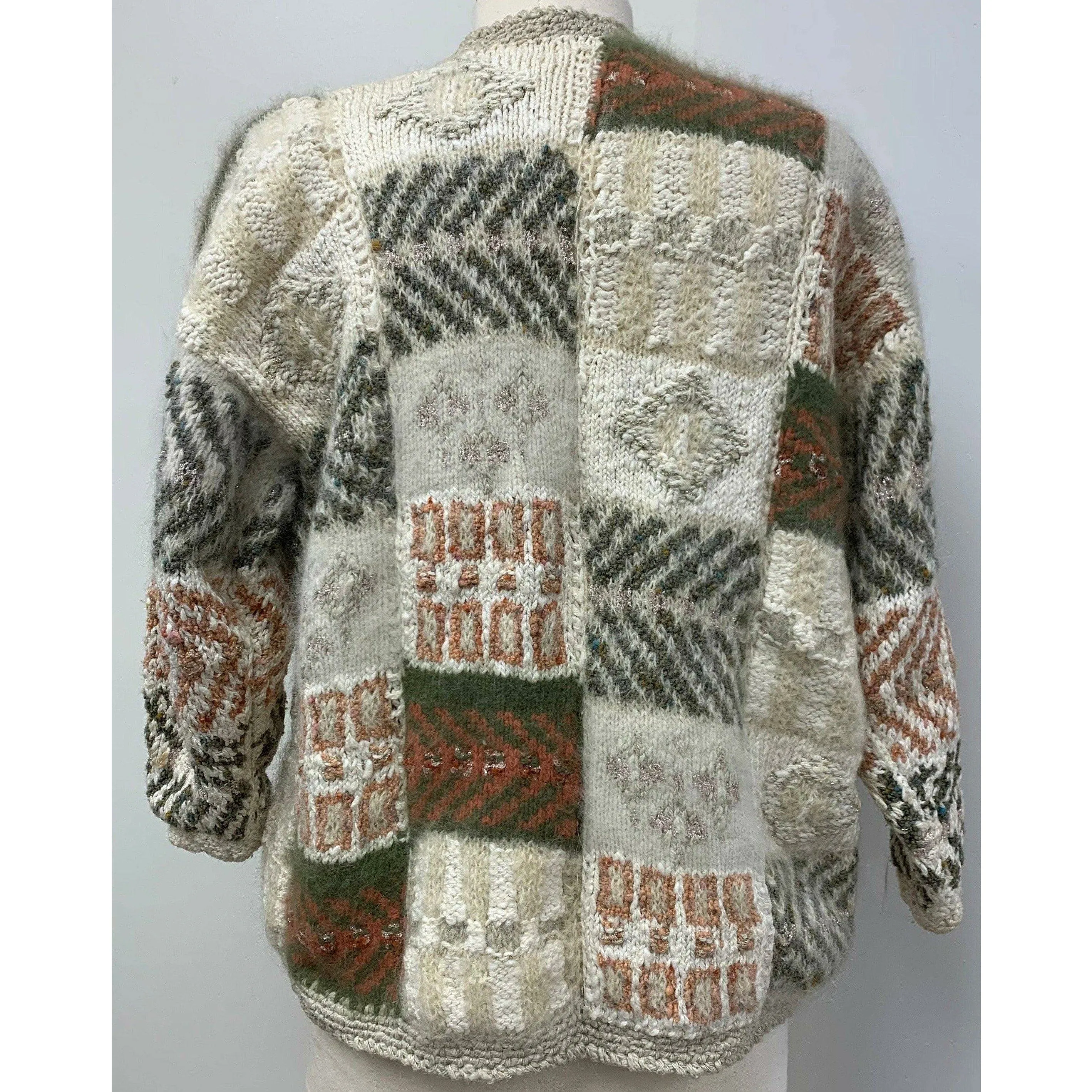 1980 Anny Blatt designed hand knit. The yarns are all French and Italian. Wool, Angora, Cotton, Linen and Mohair. Size M