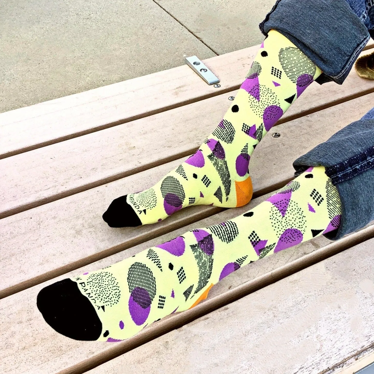 Bright Pop Art Yellow and Purple Patterned Socks from the Sock Panda