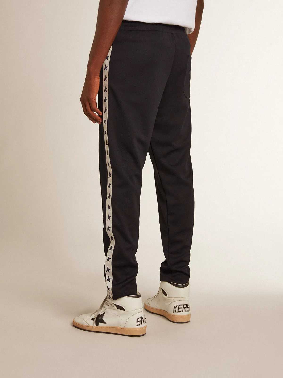 Dark blue joggers with contrasting strip and stars