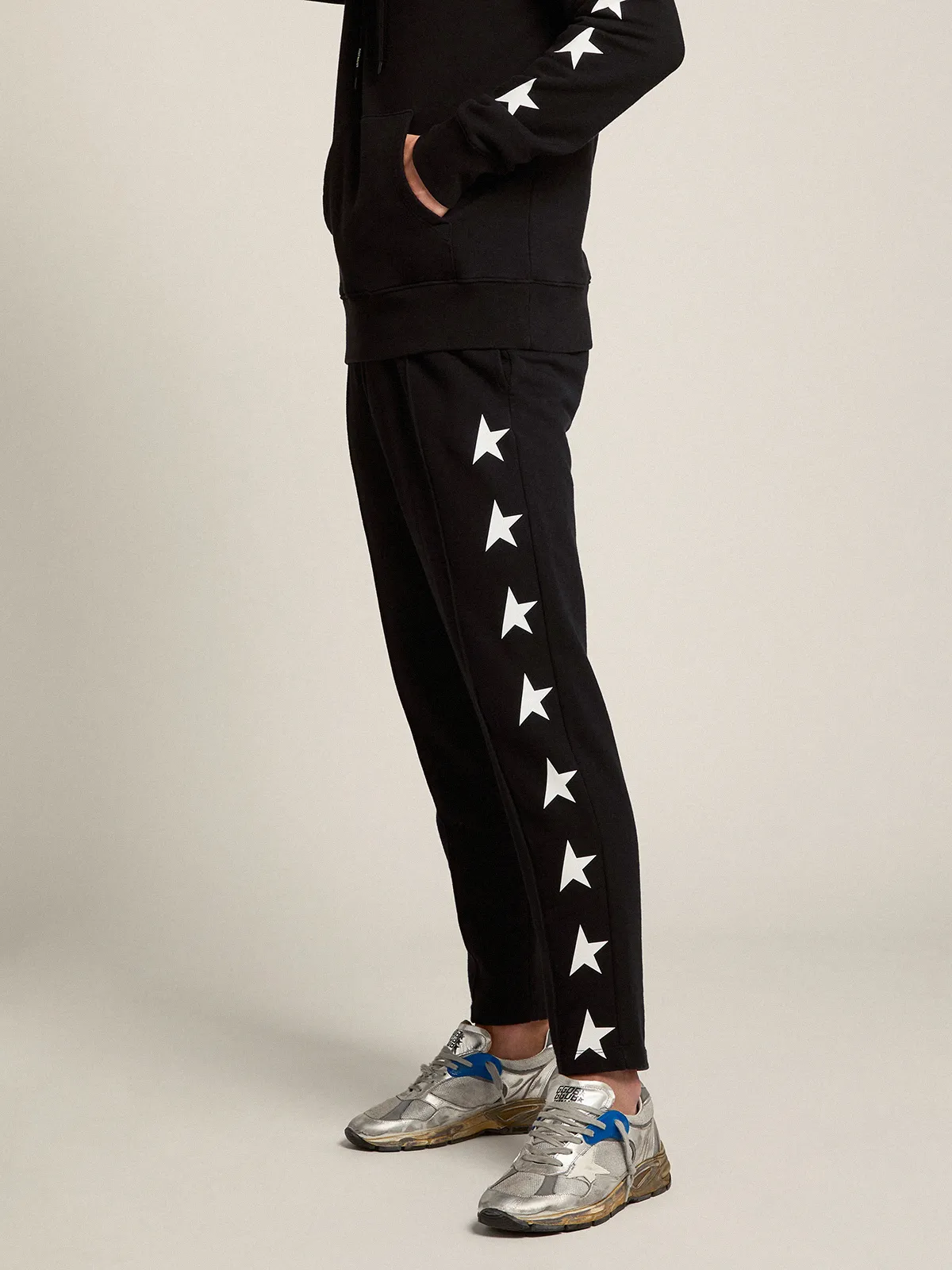 Men's black joggers with white stars