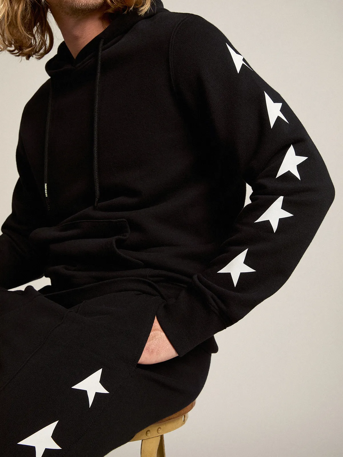 Men's black joggers with white stars