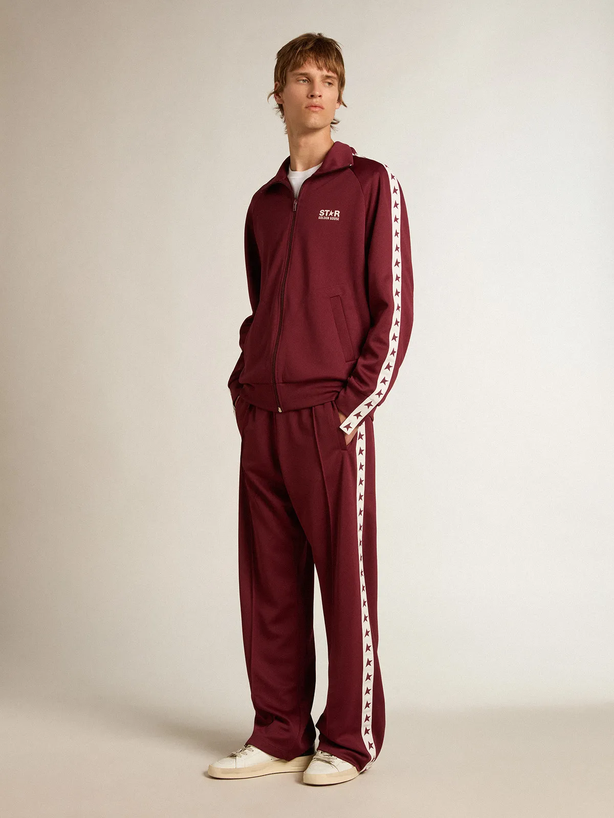 Men’s burgundy zipped sweatshirt with white strip and contrasting stars