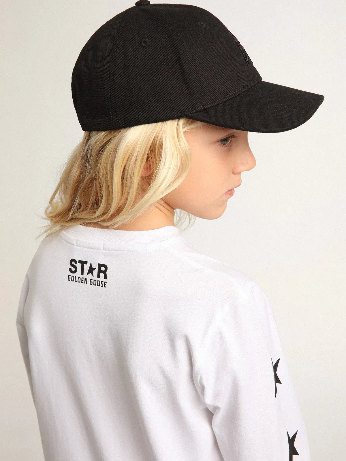 White long-sleeved T-shirt with contrasting black stars